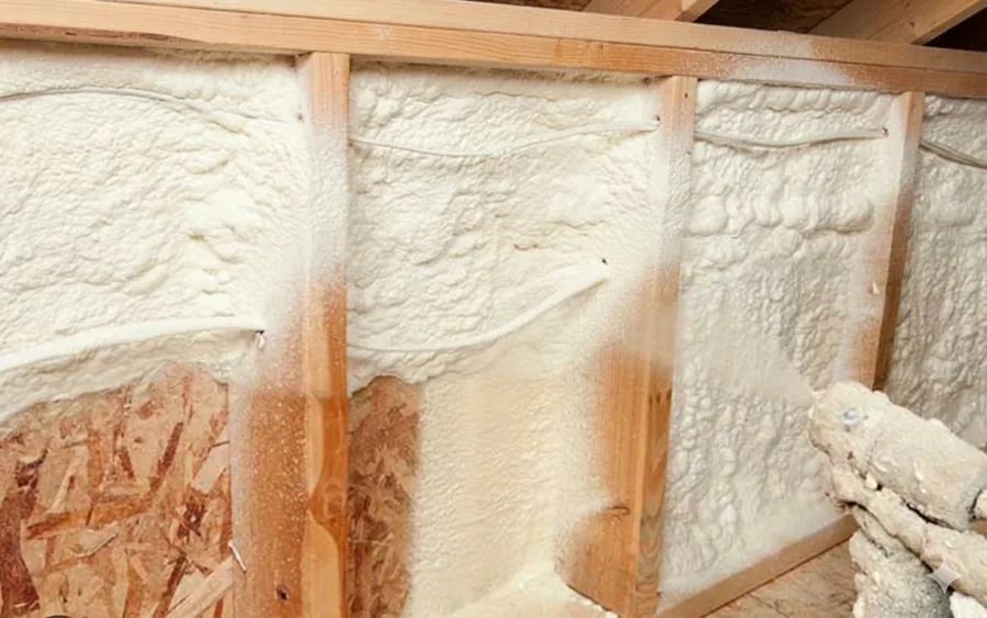 Spray foam insulation contractor applying foam to a home in North Bay Ontario